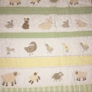 Pottery barn crib quilt and curtain top.